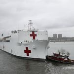 The USNS Naval Hospital Ship Comfort departs via the Hudson River, in Manhattan
